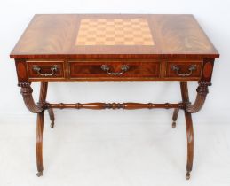 A late 20th century inlaid mahogany metamorphic games table in Regency style: the top with