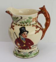 A large Fieldings Crown Devon musical John Peel jug with hunting scene decoration and fox handle