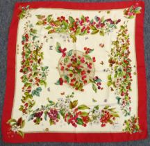 A vintage Gucci silk scarf with a design of strawberries and cherries, Gucci label and marked 100%