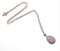 A pear-shaped pendant set with a multitude of small hand-cut pink stones; the suspension loop set