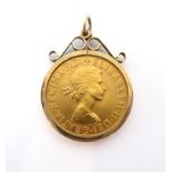 A 1968 Elizabeth II gold sovereign - in a 9ct gold pendant mount, total weight 9.4g.