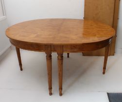 A Biedermeier-style satin birch dining table in 19th century style (later): two D-ends raised on