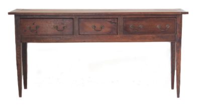 A French cherrywood dresser-base in late 18th century style (later): overhanging top with cleated