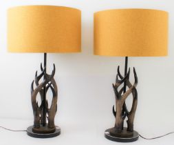 A pair of faux-antler table lamps: modern, each with three 'antlers' mounted on a stepped bronzed