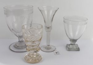 Three rummers and a wine glass: 1. a late-Georgian etched and cut glass oversized rummer, ovoid bowl