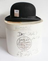 Lock & Co. (Hatters, St James St., London): a black bowler hat within original box, together with