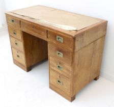 A late 19th century stained-wood pedestal desk: Rexine-inlaid top with a single full-width drawer (