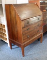 A 1930s mahogany bureau - the moulded fall front enclosing a simply fitted interior with single