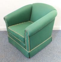 A modern green-upholstered tub-style chair (76.5 cm wide x 74 cm high).