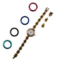 A ladies Gucci gold plated bracelet watch with interchangeable bezels - quartz movement, plain white