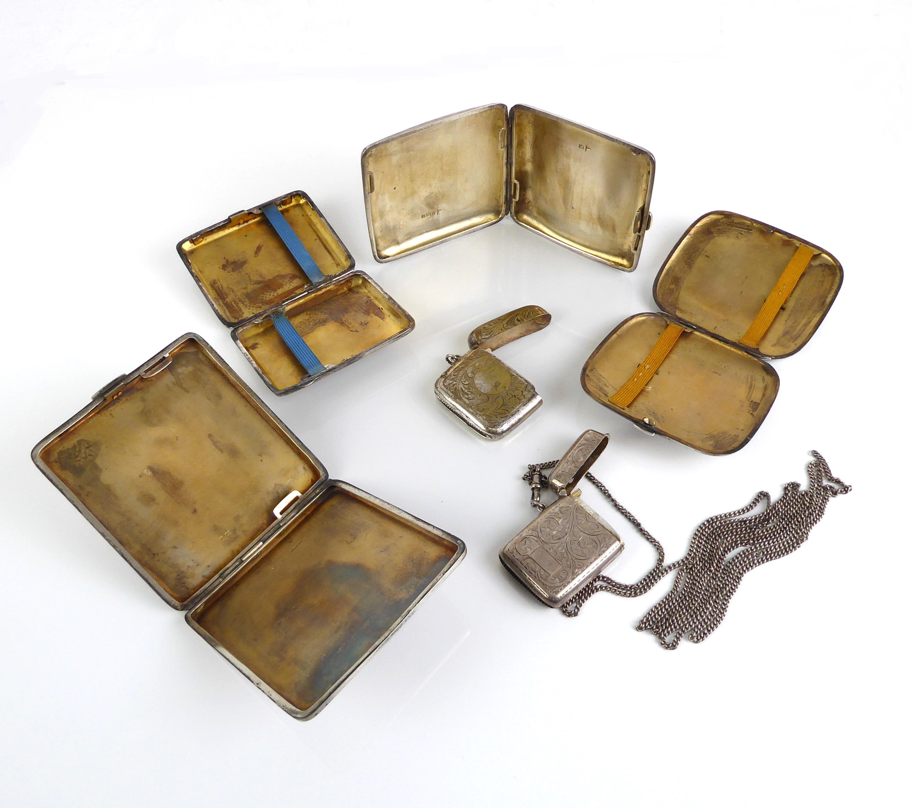 Four silver cigarette cases - with engine-turned and chased decoration, early to mid-20th century; - Image 3 of 3