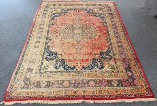 A large and heavy hand-knotted woollen North West Persian carpet: large central light-green and blue