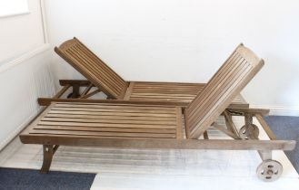 A pair of hardwood garden sun-loungers or relaxers - with four-position adjustable backs and
