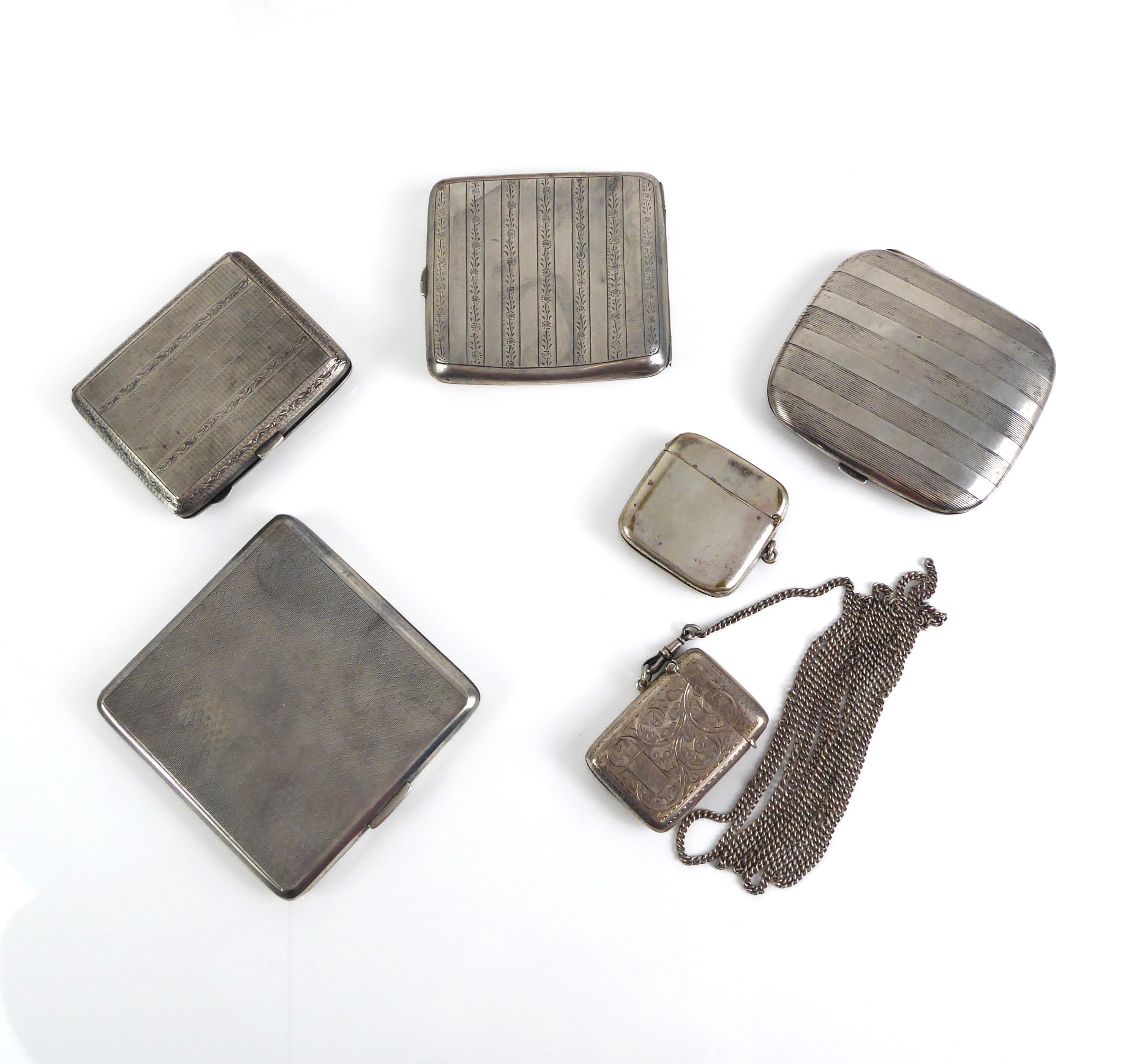 Four silver cigarette cases - with engine-turned and chased decoration, early to mid-20th century; - Image 2 of 3