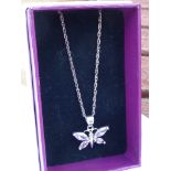 A boxed silver pendant modelled as a butterfly with hand-cut pink stones upon a silver chain.