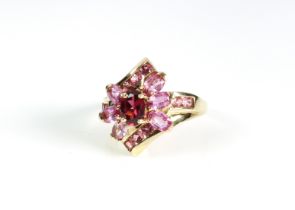 A 9ct yellow gold and pink stone cluster ring - hallmarked Birmingham 2004, size P½.
