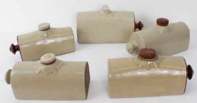 Five similar early 20th century stoneware hot-water bottles.