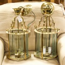To be sold on behalf of the RNLI:  A pair of brass and faceted glass ceiling hanging lamp lanterns