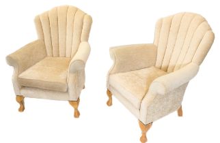 A pair of modern beige upholstered Bafford armchairs with scallop-shell-style shaped backs and