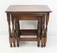 A nest of three oak occasional tables (the largest 50.5 cm high x 47 cm high).