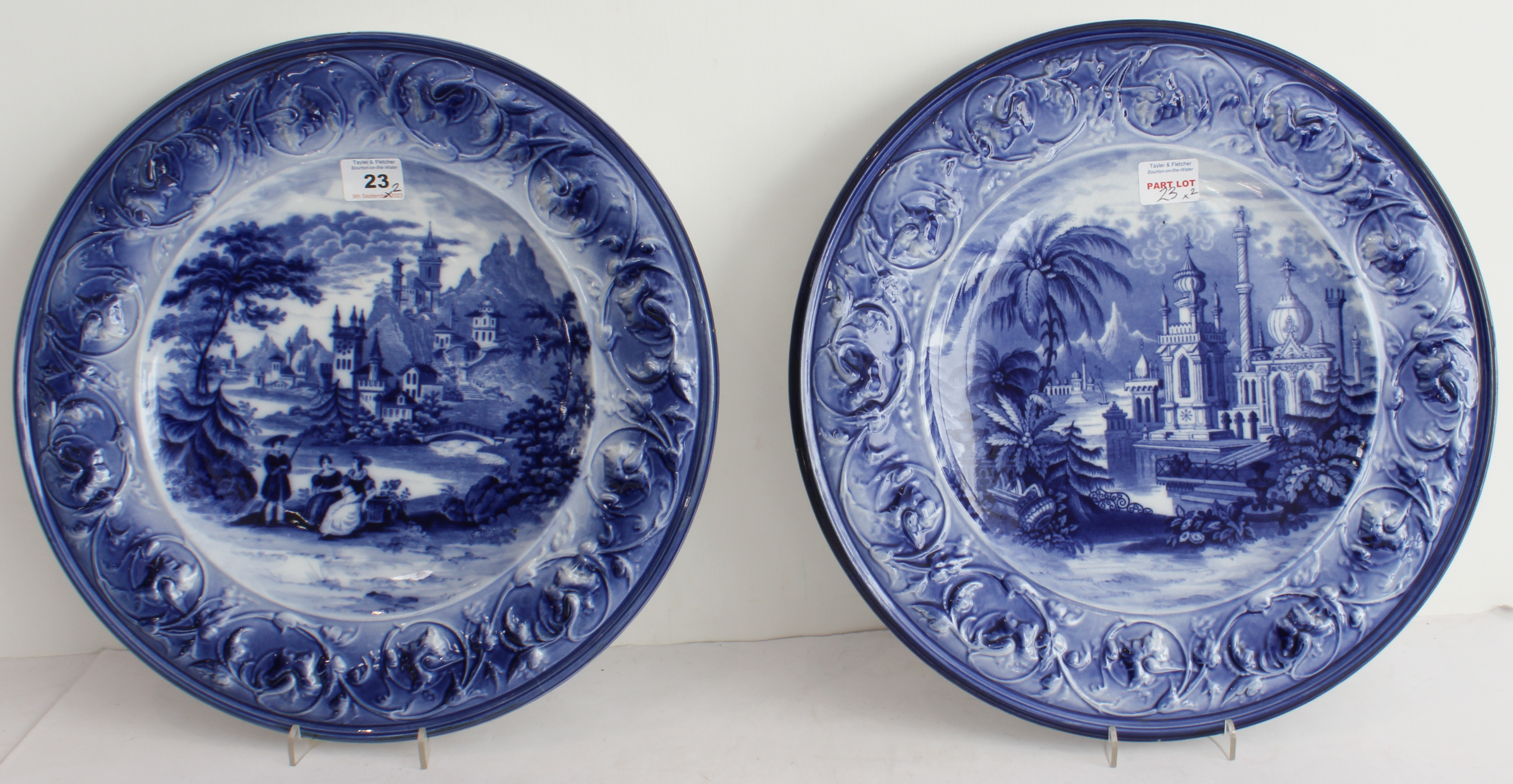 A pair of 19th century blue-and-white pottery chargers. One decorated in European style with