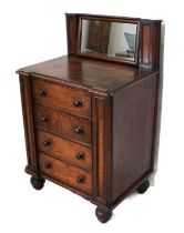 An early 19th century late Regency period oak and mahogany-banded dressing-chest of unusual style