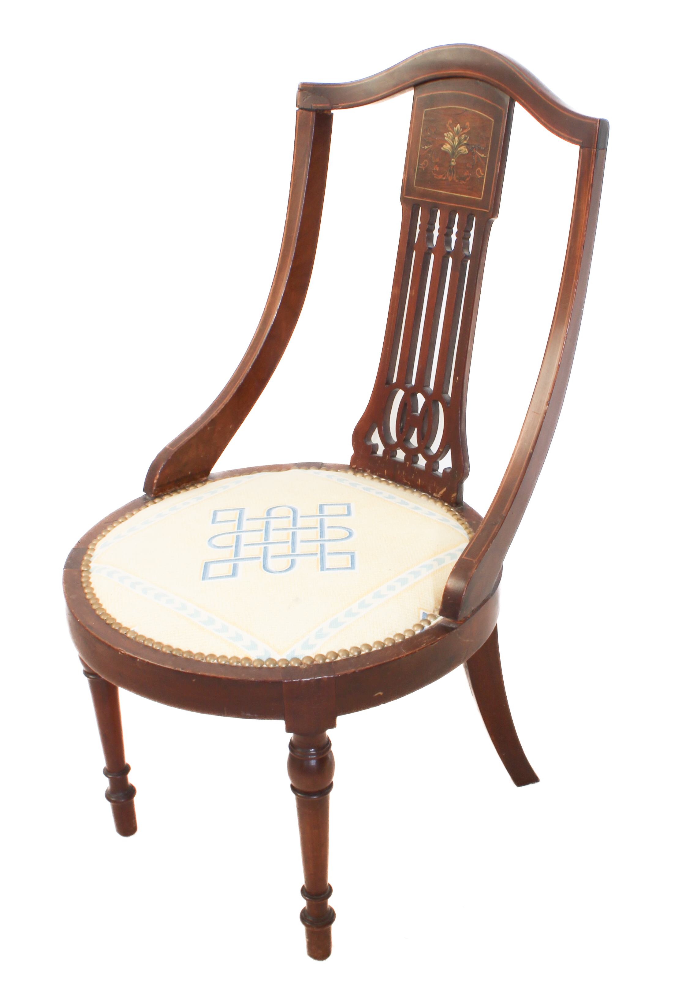 An Edwardian mahogany and marquetry nursing chair - pierced bar splat headed by a foliate