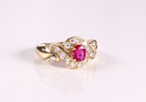 A 9ct yellow gold, pink and clear stone cluster ring - Sheffield hallmarks, with cross over setting,