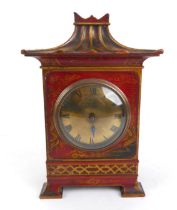 An Edwardian red chinoiserie lacquered and parcel gilt mantel clock - with flared, fluted pagoda