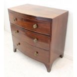 An early 19th century mahogany bowfront caddy-topped chest of small proportions: three full-width