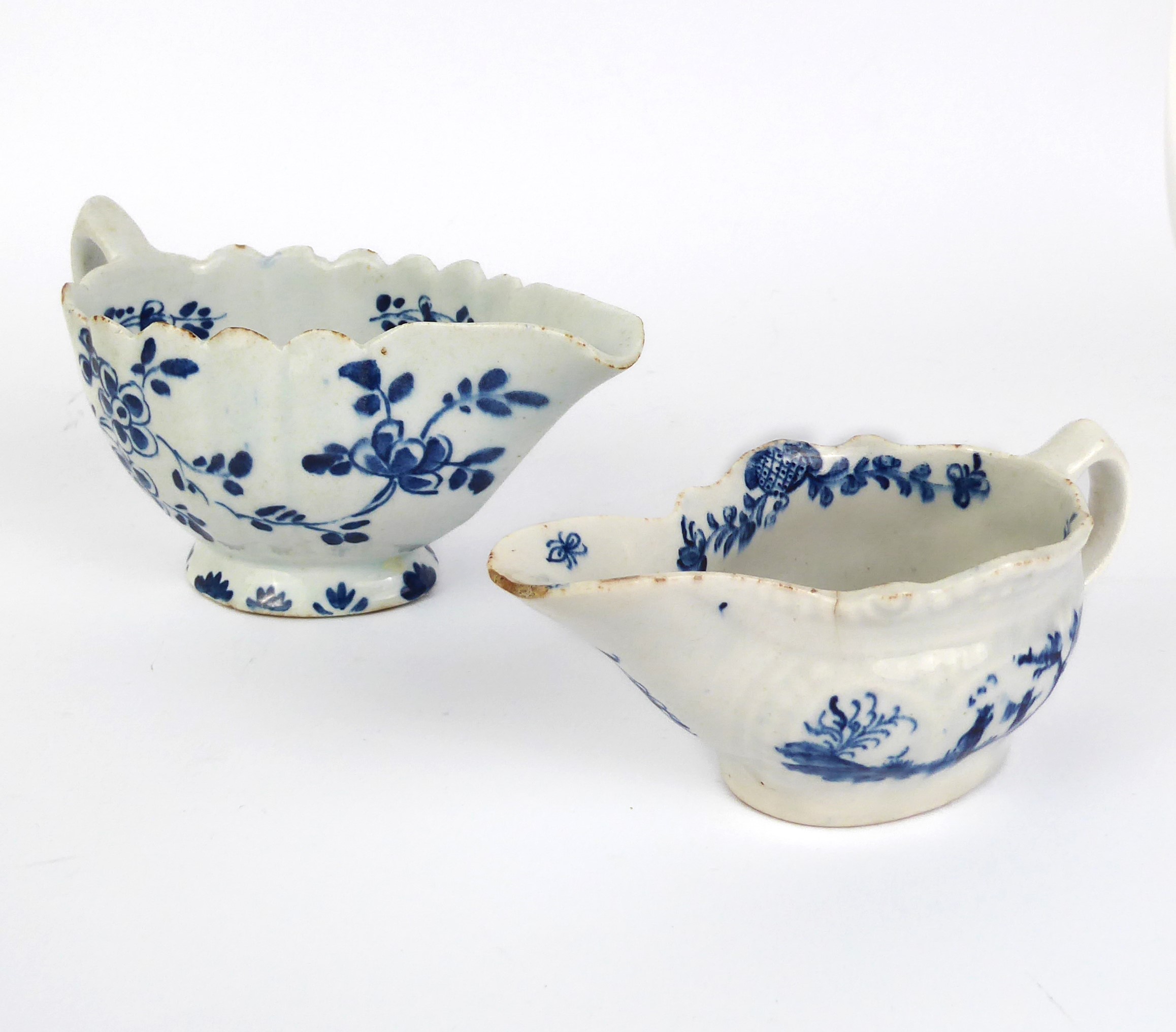 Two early 19th century English porcelain cream jugs - both painted with blue and white decoration, - Image 2 of 9