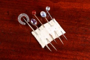 Five vintage stick pins - early to mid-20th century, including a silver and cabochon moonstone