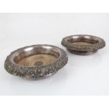 A large and heavy pair of 19th century silver-plated wine bottle coasters: faded turned wooden