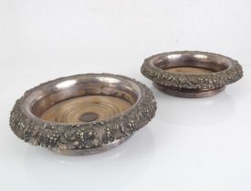 A large and heavy pair of 19th century silver-plated wine bottle coasters: faded turned wooden