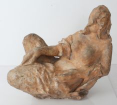 A mid 20th century plaster sculpture (painted as terracotta): the recumbent female subject with long