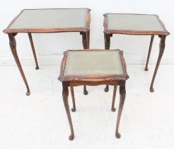 A nest of three carved walnut tables - third quarter 20th century, each serpentine, rectangular