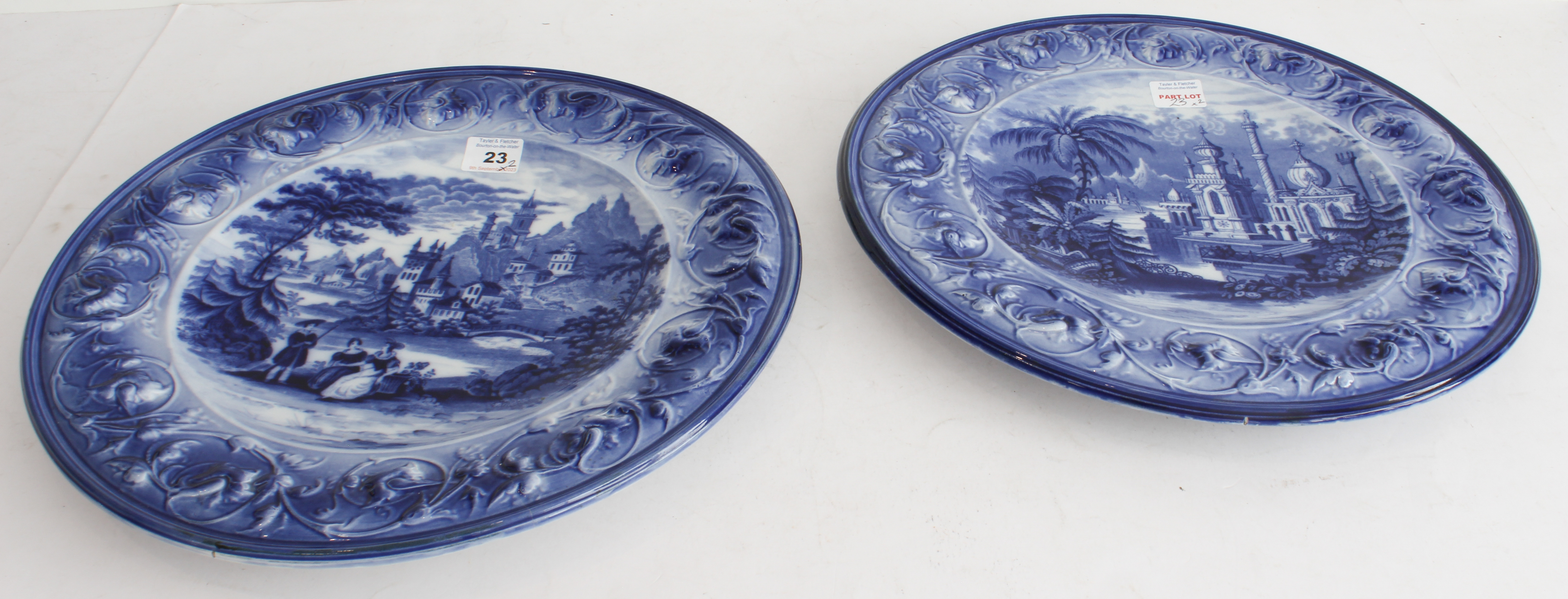 A pair of 19th century blue-and-white pottery chargers. One decorated in European style with - Image 3 of 5