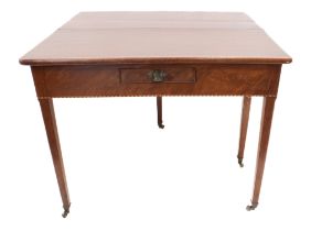 A late 18th century George III period foldover top walnut tea-table: small single central drawer