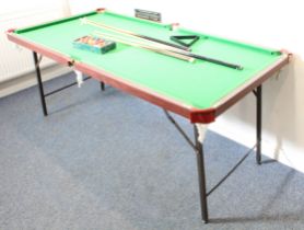 A 6ft snooker / billiards table - with folding metal legs and adjustable feet, together with two