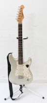 An 'Aria' ETG- Series six-string electric guitar with silver body, rosewood neck and maple back,