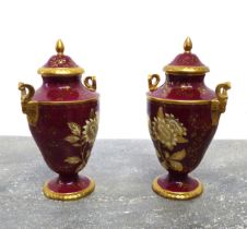 A pair of boxed Wedgwood Ruby Tonquin two-handled vases and covers - printed factory marks, of urn