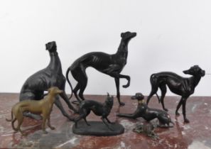 Seven bronze and bronzed metal figures of Whippets - including a modern dark brown patinated