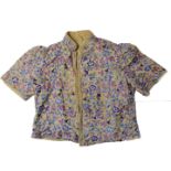 A vintage Chinese embroidered silk child's jacket - early 20th century, with short sleeves and