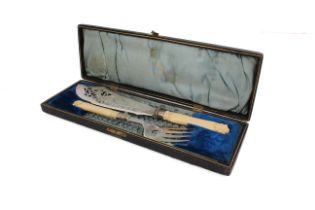 A cased pair of late-Victorian silver-plated fish servers - with chased floral and foliate