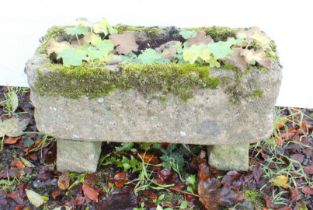 A small composition stone garden trough