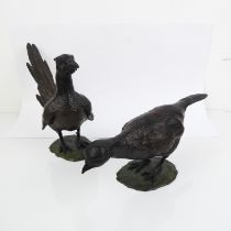 A pair of patinated bronze figures of pheasants - late 20th century, depicting a cock and hen