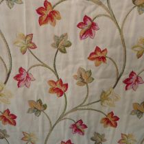 A pair of curtains with tie backs in a heavy tapestry effect fabric from John Lewis; triple pinch