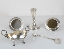 A silver selection to include - a pair of small circular hallmarked silver easel-style photograph