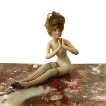 A bisque porcelain bathing belle or beauty - early 20th century, modelled as a female seated nude
