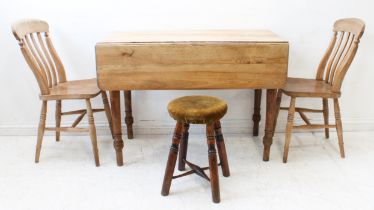 Four pieces: 1. A bleached mahogany Pembroke table with end drawer and raised on turned tapering